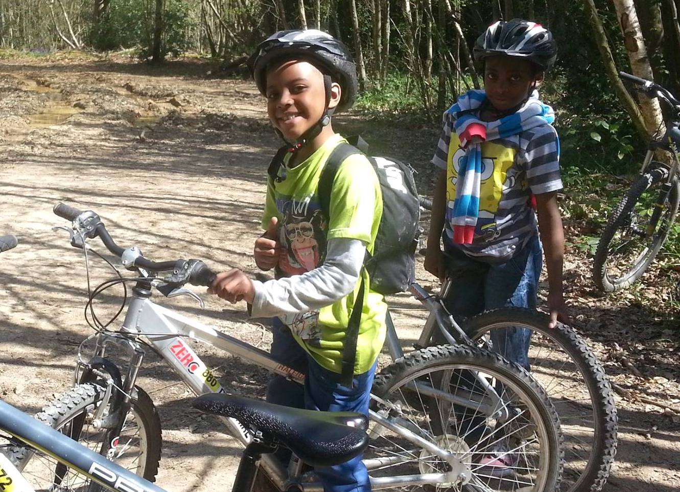 Young people out on a bike trip through the forest