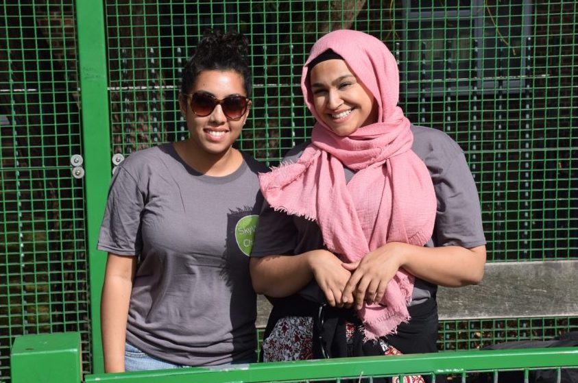 Two volunteers stood together smiling at SkyWay