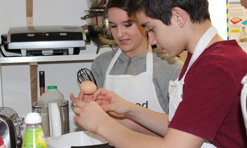Two young people cooking