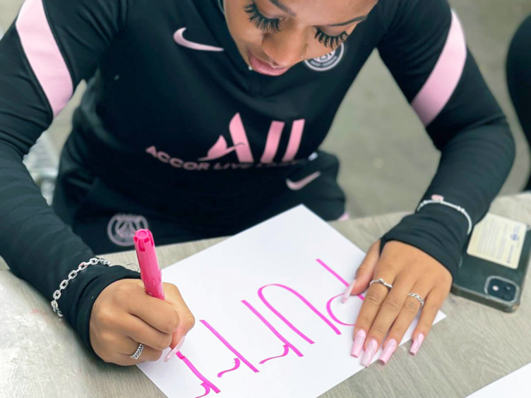 One of the girls from our girls group drawing her graffiti art design