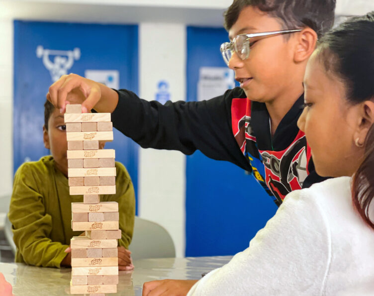 Young kids playing Jenga