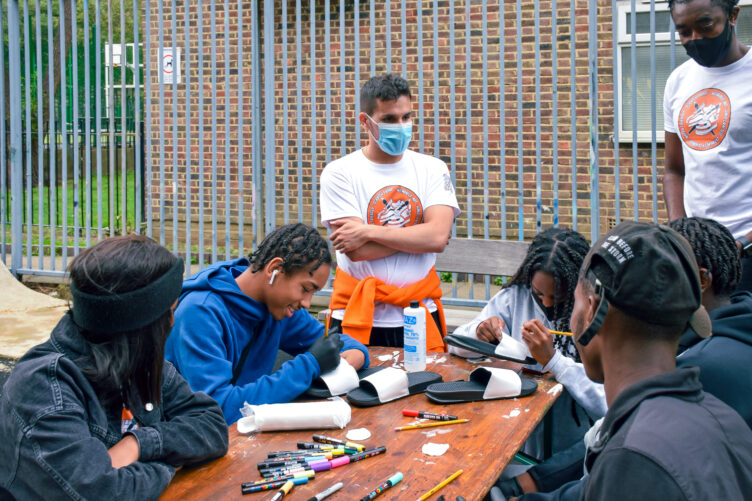 Joshua and Santiago running a custom sliders workshop with a 15+ group