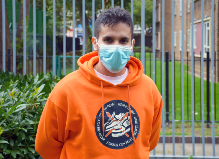 Santiago standing outside the Blue Hut Youth & Community Hub