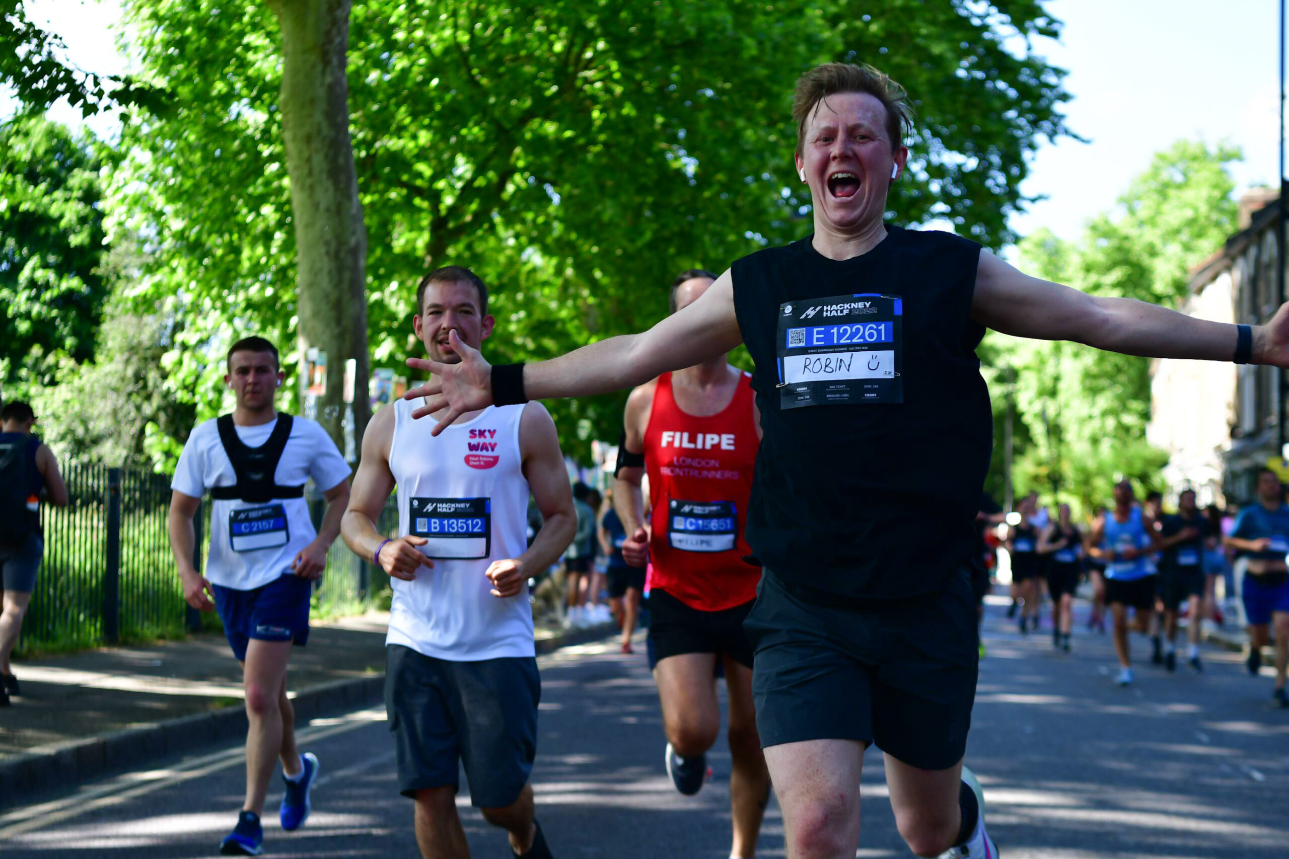 Runners celebrating in the Hackney Half Marathon 2022